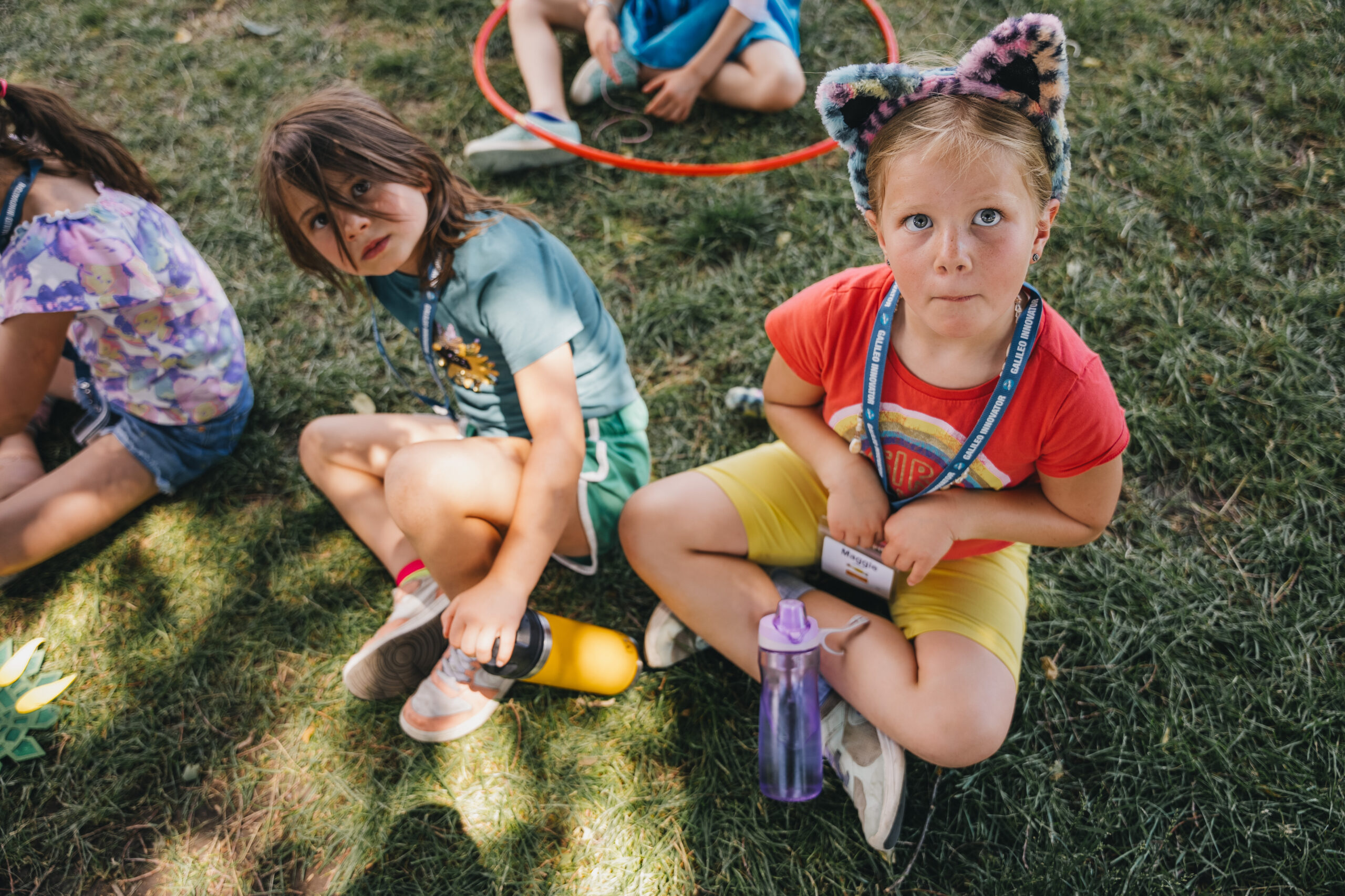 girls playing outdoor games and looking at camera