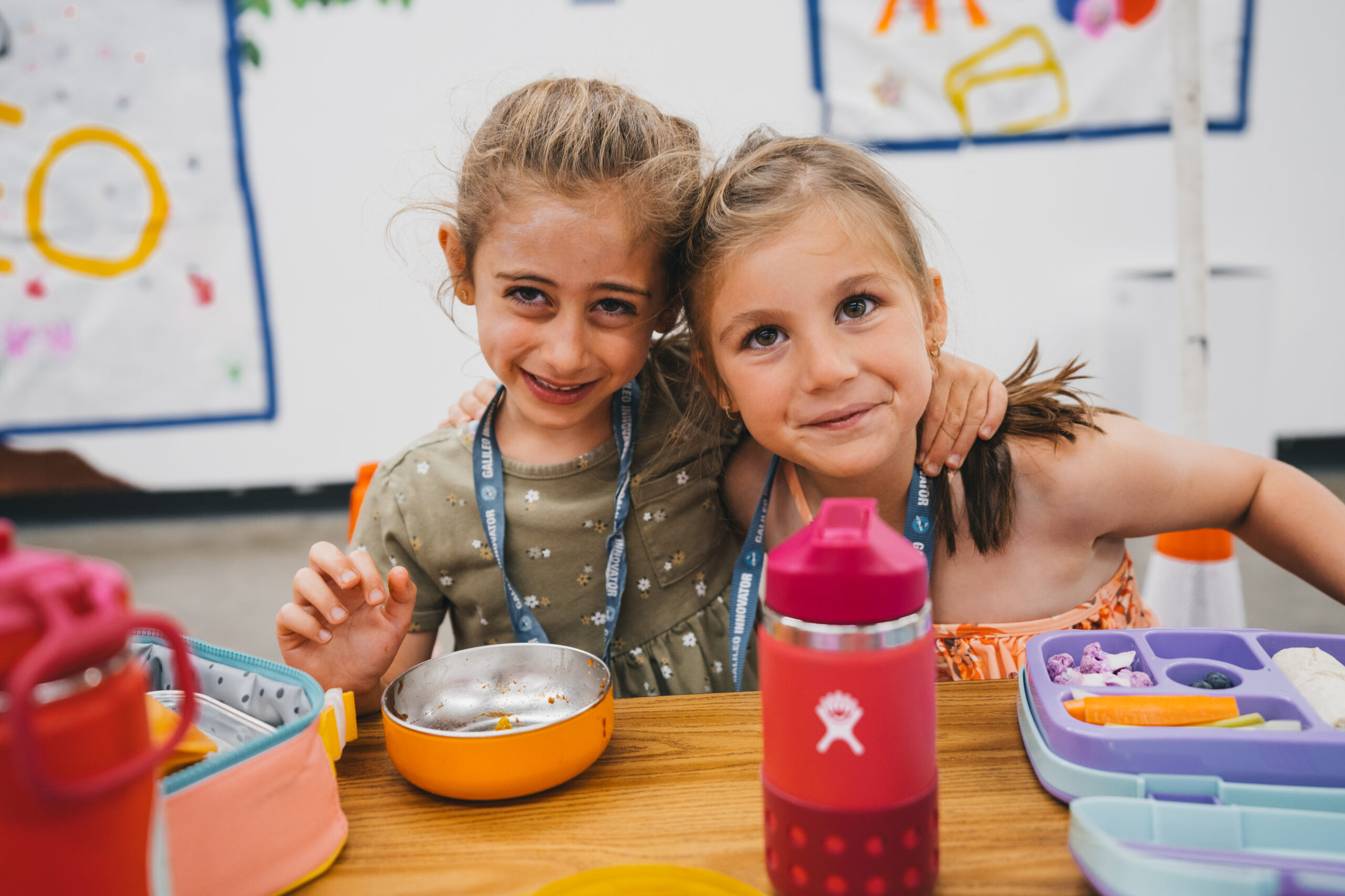 girls having lunch and smiling 