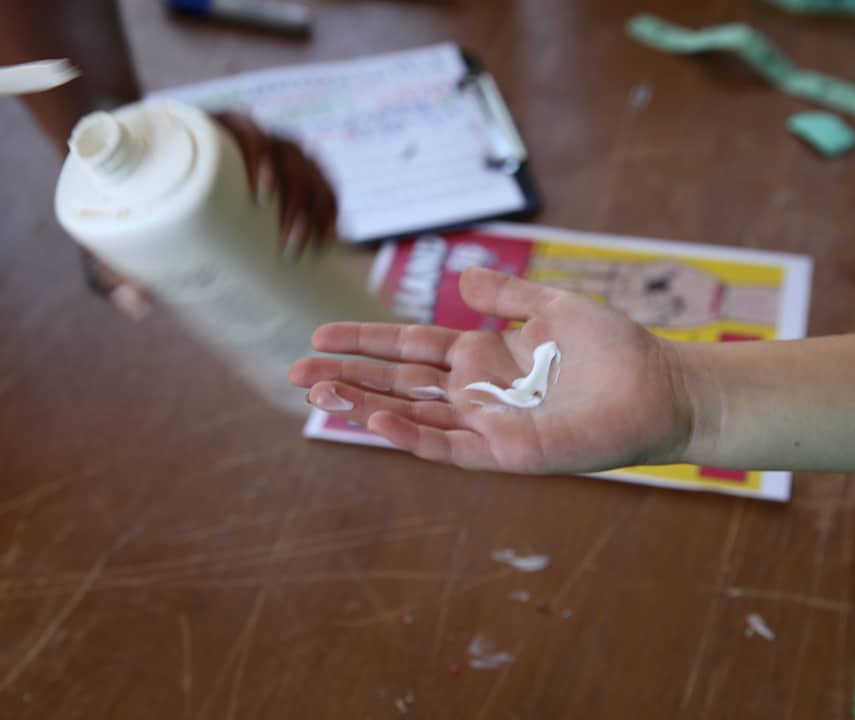 Using lotion before dipping hand in wax