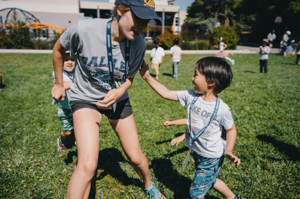 Campers playing in field