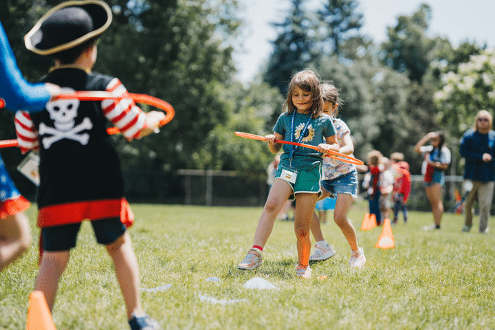 Campers playing with hula hoops